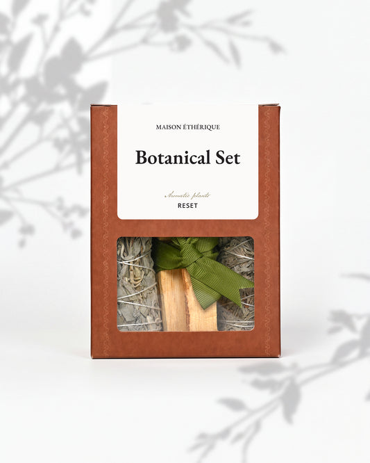 Botanical Set — Reset: terracotta Maison Éthérique box with a window showing white sage, blue sage and Palo Santo tied with green ribbon.