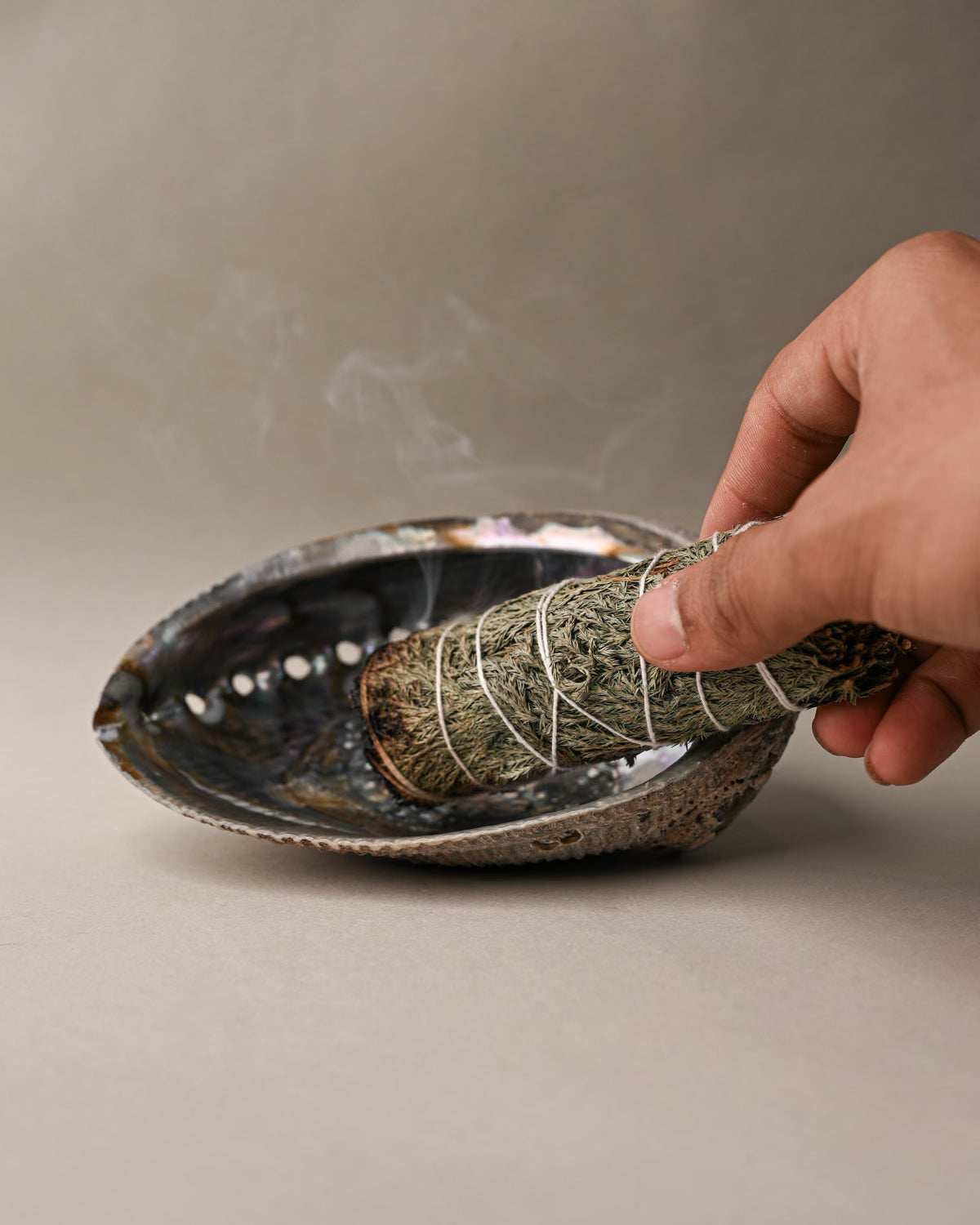 Burning Cedar smudge stick