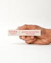 Hand holding Austha Suganda Incense