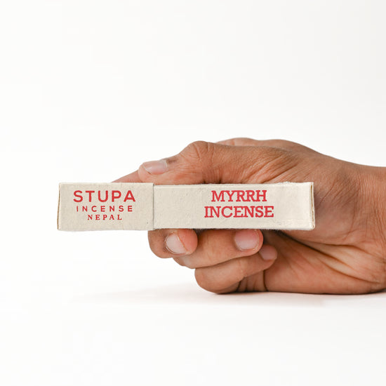 Hand holding Myrrh Incense
