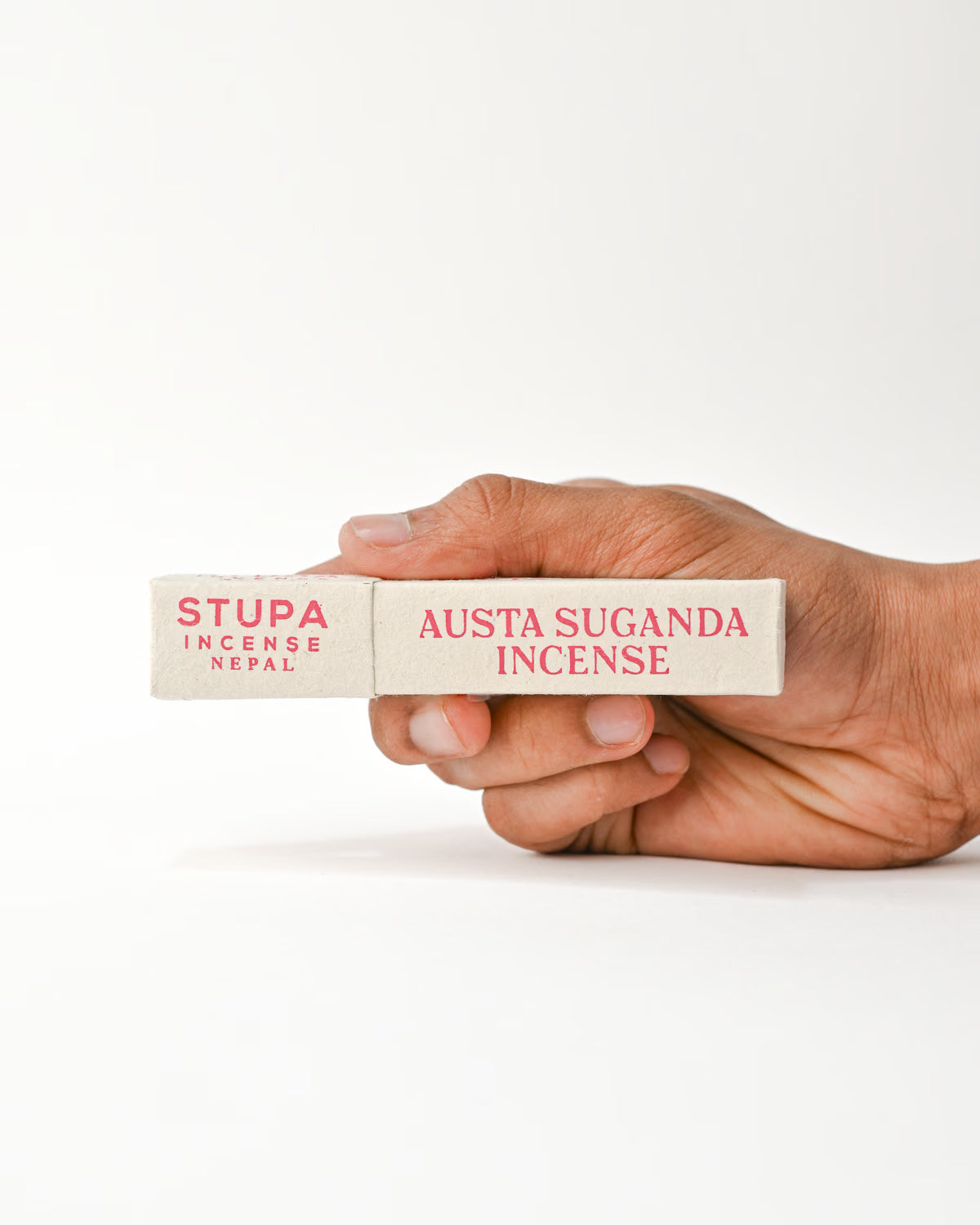 Hand holding Nag Champa Incenses 
