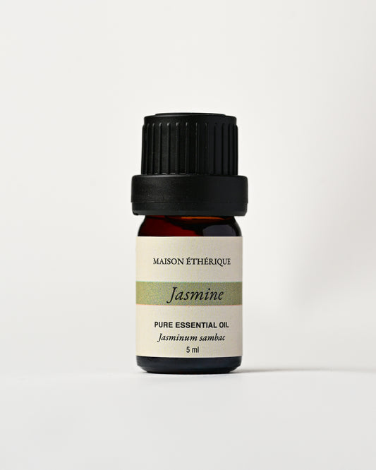 Jasmine Essential Oil 5ml: small amber glass bottle with black cap and Maison Éthérique label reading Jasminum sambac.