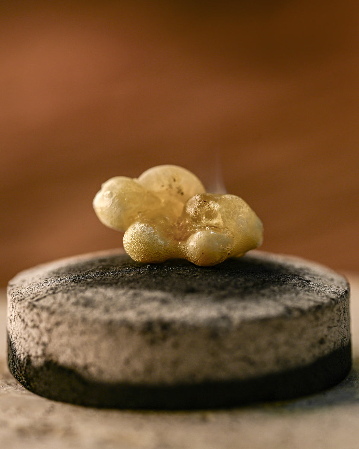 Macro shot of frankincense melting