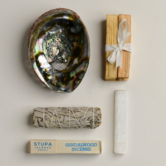 contents of meditation ritual kit on white surface 