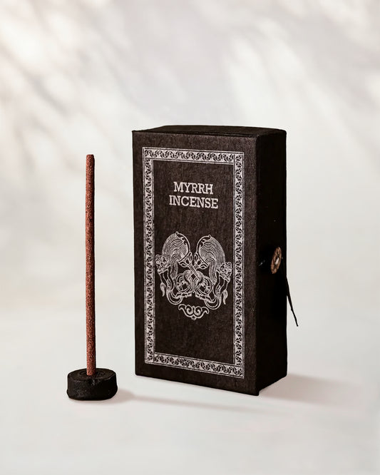 Myrrh Incense Sticks, box of 40: dark brown Stupa paper box with silver print beside a stick standing in a small holder.