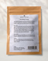 Back of a Maison Éthérique kraft pouch of Palo Santo sticks, showing the printed label with instructions and barcode.