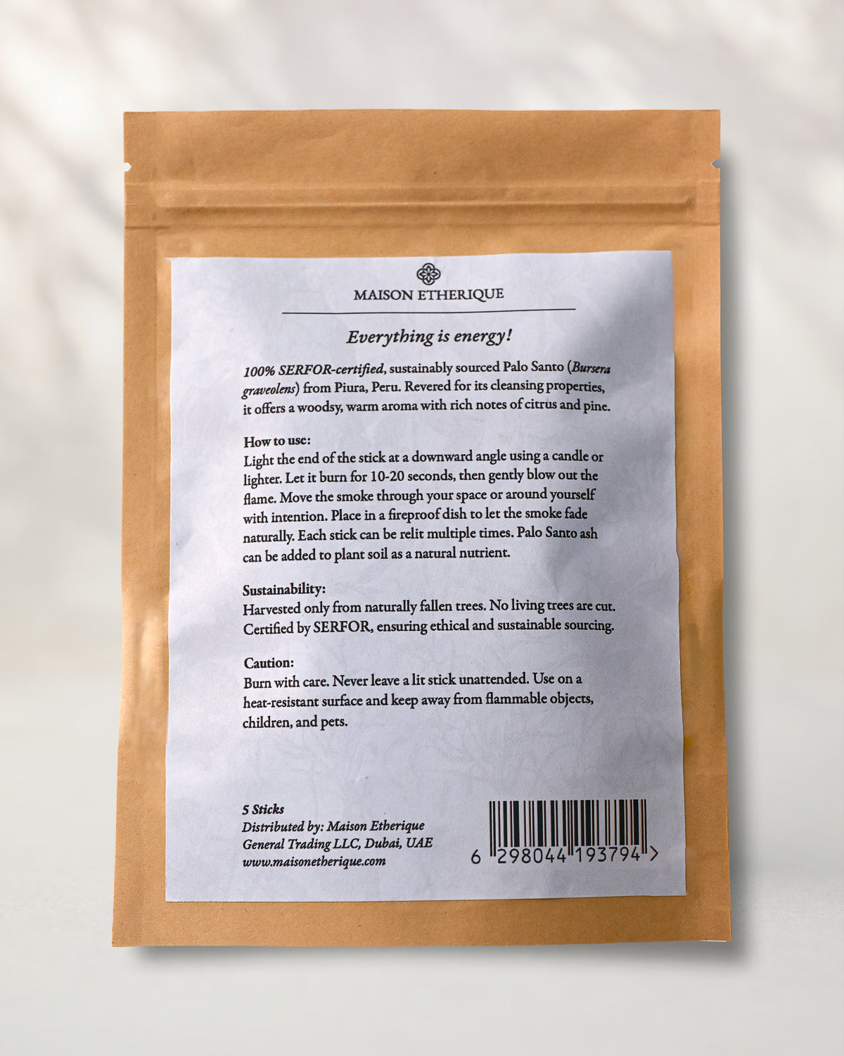Back of a Maison Éthérique kraft pouch of Palo Santo sticks, showing the printed label with instructions and barcode.