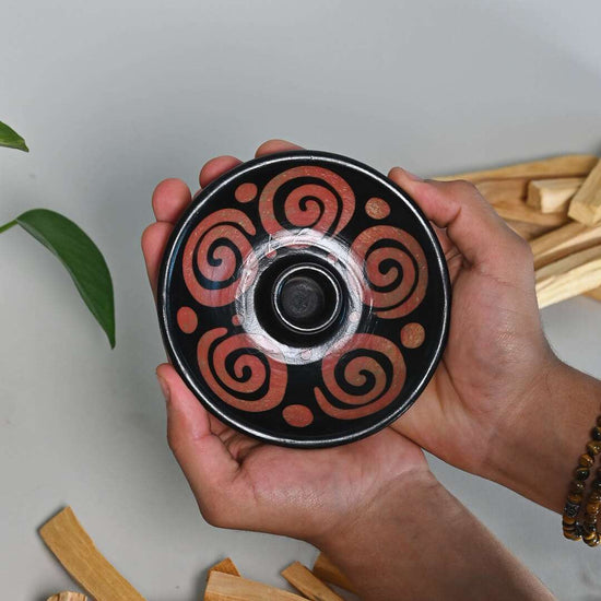 Hands holding A Palo Santo Stick Burner - Air