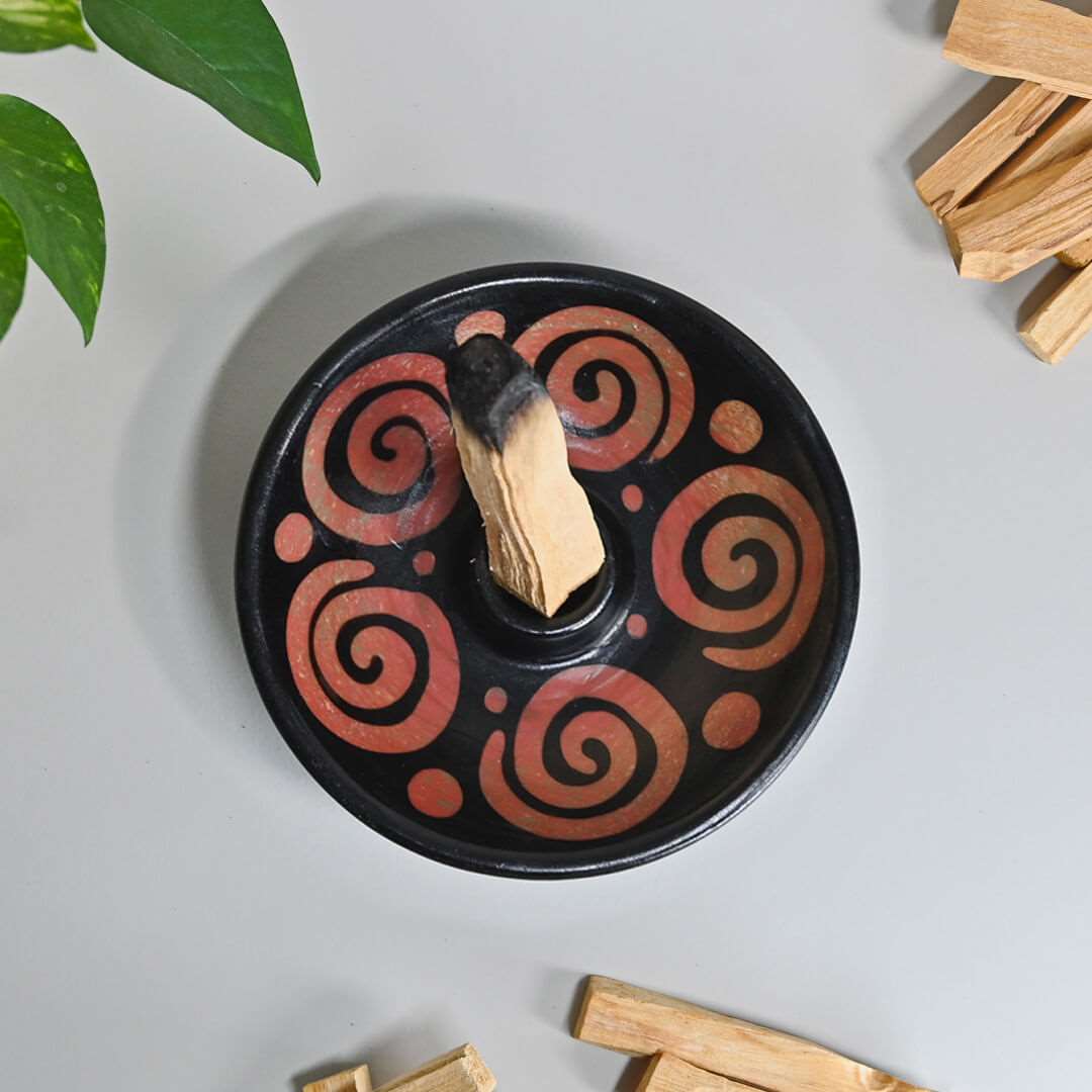 A burned Palo Santo Stick inside a palo santo Burner -Air from the top