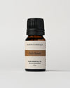 Palo Santo essential oil from Peru: 10 ml amber bottle of Maison Éthérique pure essential oil (Bursera graveolens) on a pale background.