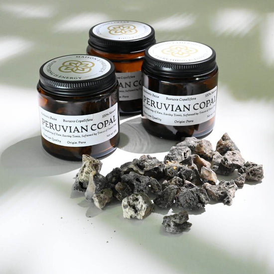 3 jars of Peruvian Copal and with Peruvian Copal spread on white surface