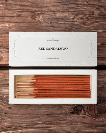 Red Sandalwood incense sticks: Maison Éthérique white box lid above the open box of red-brown sticks, on a wooden surface.