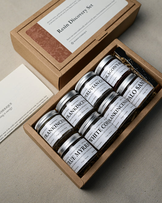 Open Resin Discovery Kit seen at an angle, eight small jars of resin with silver lids in a kraft box.