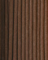 Close view of Na Swa incense sticks laid side by side, showing their brown texture.
