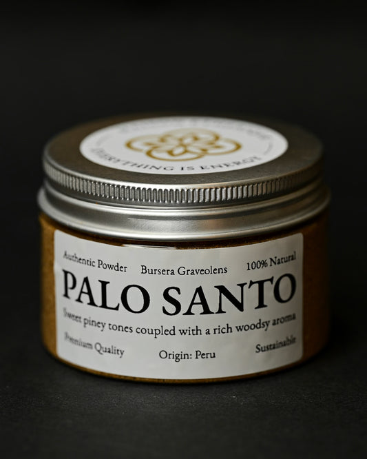 Round tin of Maison Éthérique Palo Santo powder (Bursera graveolens) from Peru with a silver lid, on a dark background.