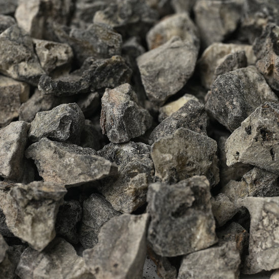 Close view of grey-black Peruvian Black Copal resin pieces (Bursera copallifera).