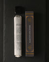 Samten Tibetan incense: paper-wrapped bundle, dark box and small holder laid out on dark slate.