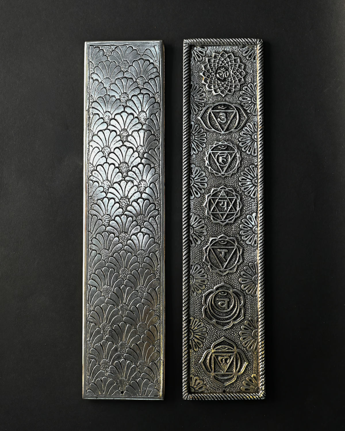 Back and front of the 7 Chakra metal incense stick holder side by side, showing the embossed fan pattern and seven symbols.