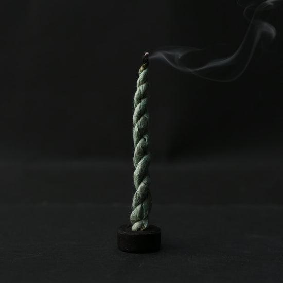 single burning shot of bundle of Devdar Lokta Rope Incense Tube