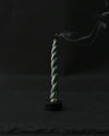 single burning shot of bundle of Devdar Lokta Rope Incense Tube